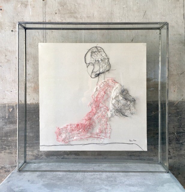 KNEELING WOMAN